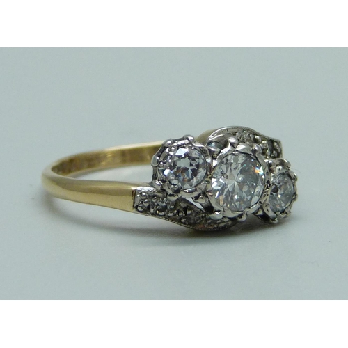 940 - A 1940's 18ct gold and diamond ring, approximately 0.80ct diamond weight, 3.2g, M