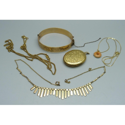 941 - A 9ct gold metal core bangle, a rolled gold locket, a necklace, etc.