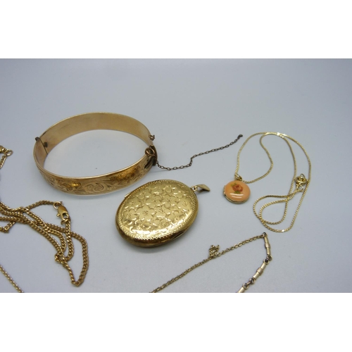 941 - A 9ct gold metal core bangle, a rolled gold locket, a necklace, etc.