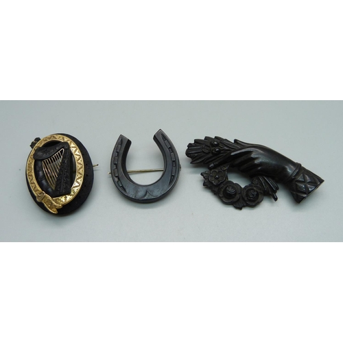 950 - A c1900 bog oak Irish harp brooch and two other brooches