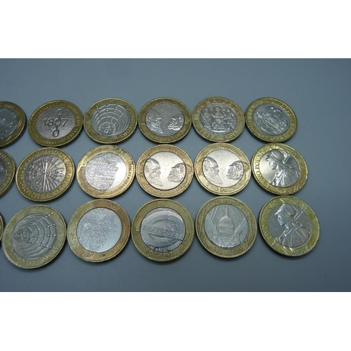 956 - Twenty-four collectable £2 coins including four Darwin, four WWI, two Shakespeare, etc.