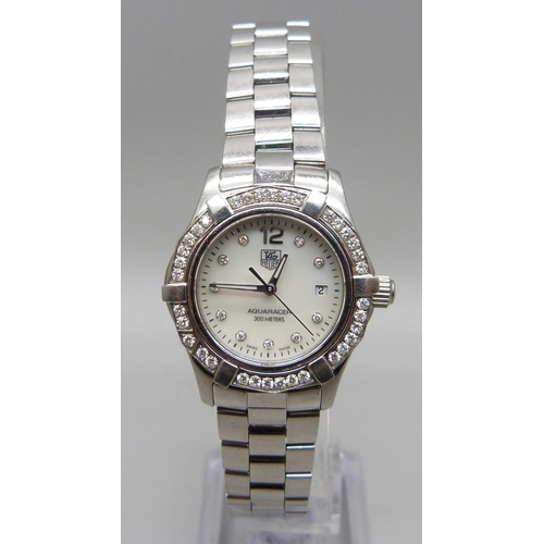 977 - A lady's Tag Heuer Aquaracer wristwatch set with 45 diamonds, approximately 0.55 carat diamond weigh... 