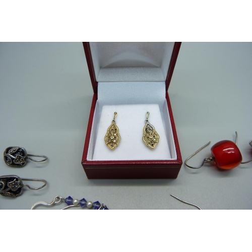 979 - A pair of silver gilt diamond set earrings and 20 pairs of silver earrings