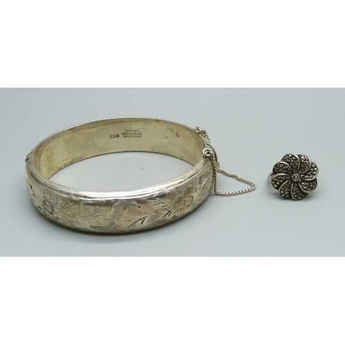 991 - A silver bangle, 32g, and a silver ring, L/M