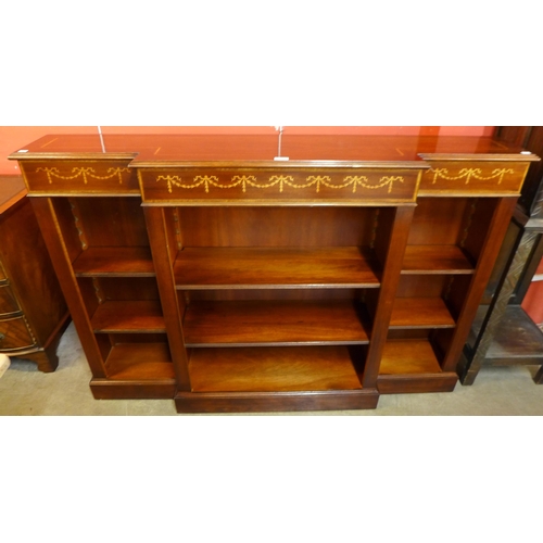 113 - A Regency style inlaid mahogany open breakfront bookcase