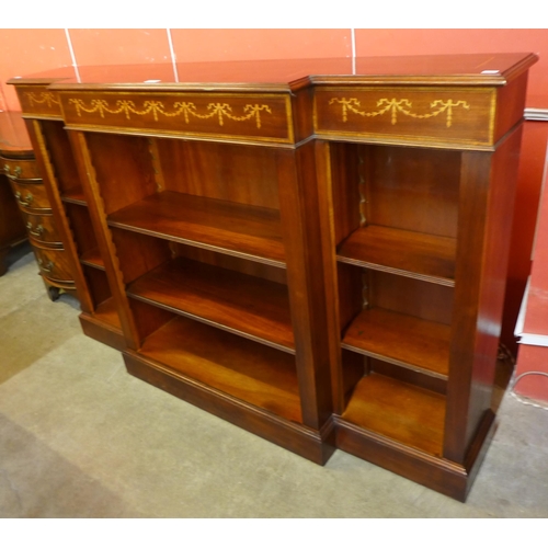 113 - A Regency style inlaid mahogany open breakfront bookcase