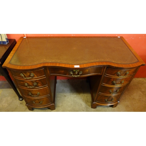 114 - A George III style Bevan Funnell mahogany and green leather topped desk