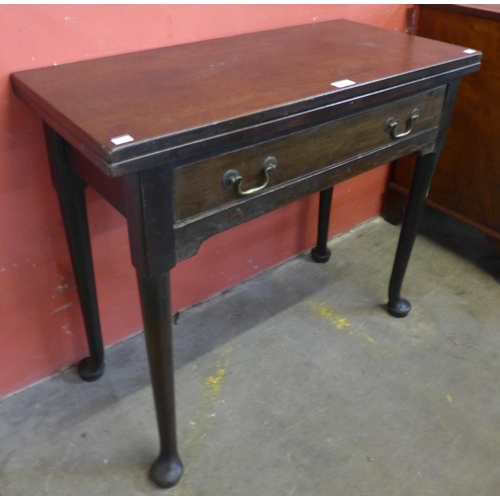 115 - A George II mahogany single drawer rectangular fold over tea table