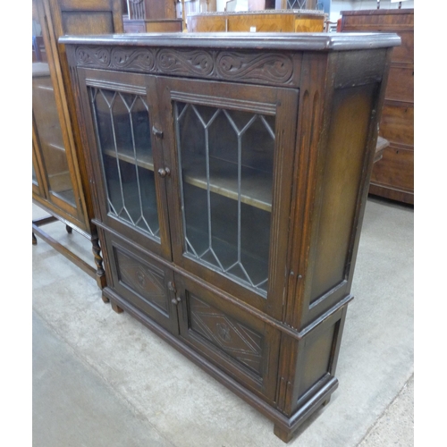 128 - A carved oak four bookcase