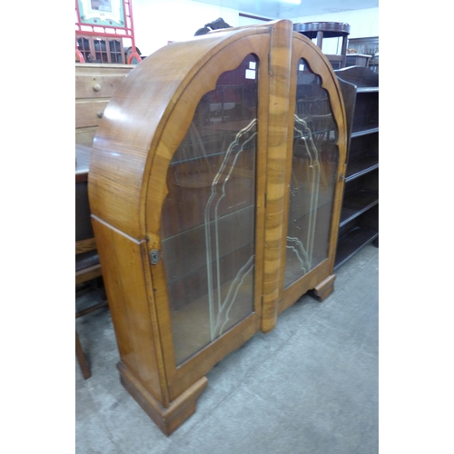 130 - An Art Deco walnut display cabinet