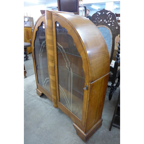 130 - An Art Deco walnut display cabinet