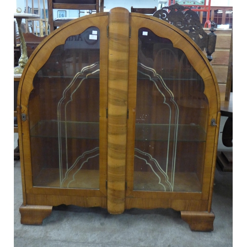 130 - An Art Deco walnut display cabinet