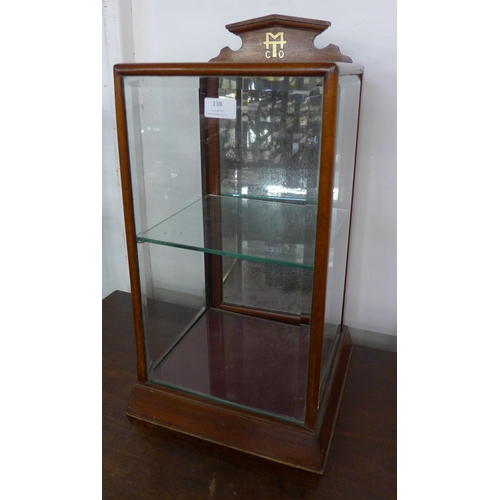 138 - An early 20th Century glazed mahogany counter top shop display cabinet, marked M.T. Co.