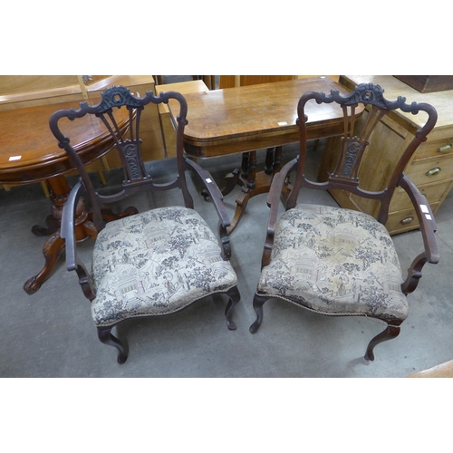 148 - A pair of Edward VII mahogany elbow chairs