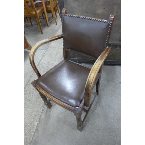 157 - An oak seven piece dining suite, comprising; draw leaf table, four chairs and a sideboard