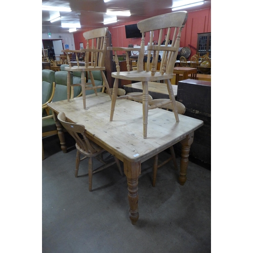 159 - A pine farmhouse kitchen table and six beech chairs