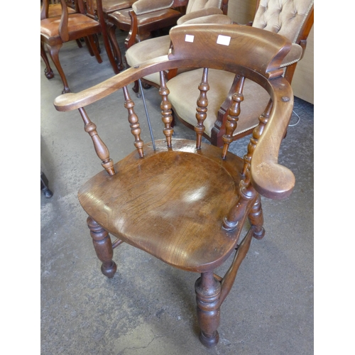 164 - A Victorian elm smoker's bow chair