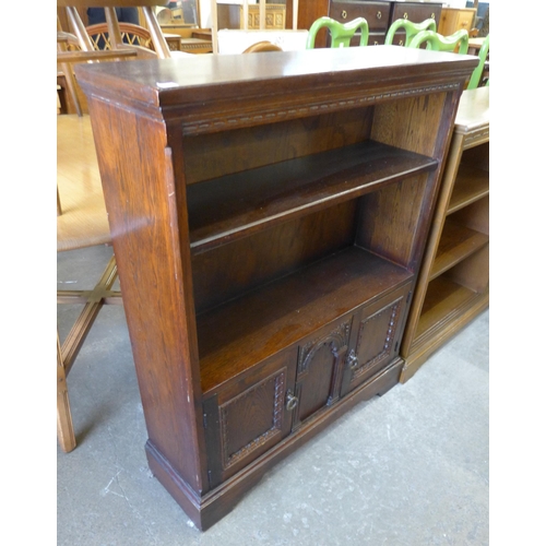 166 - A Jaycee carved oak open bookcase