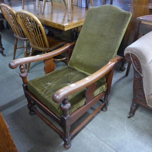 192 - An Art Deco oak reclining fireside armchair