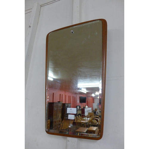 20 - A teak framed  mirror and a contemporary wall clock