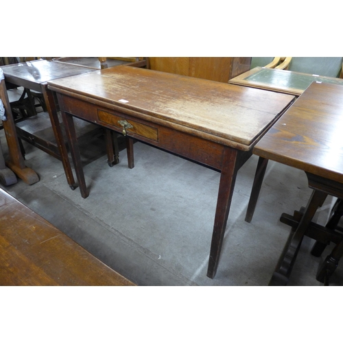 209 - A George III oak rectangular fold over tea table