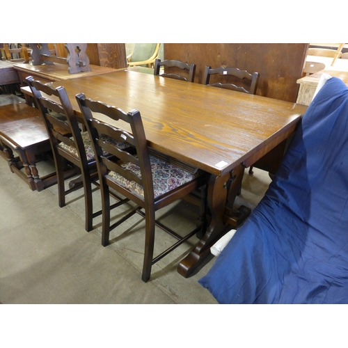 211 - An oak refectory table and four chairs