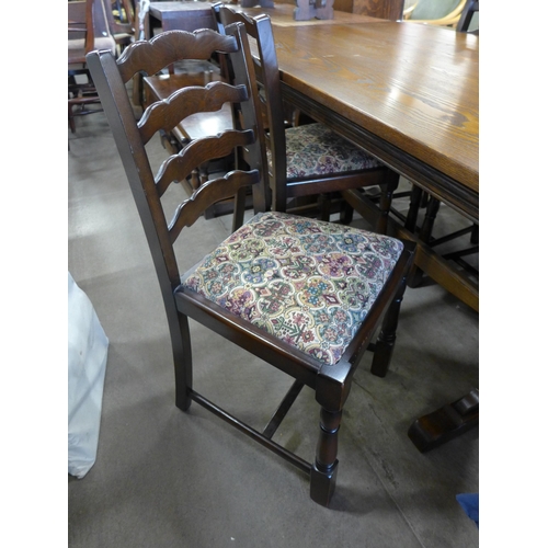 211 - An oak refectory table and four chairs