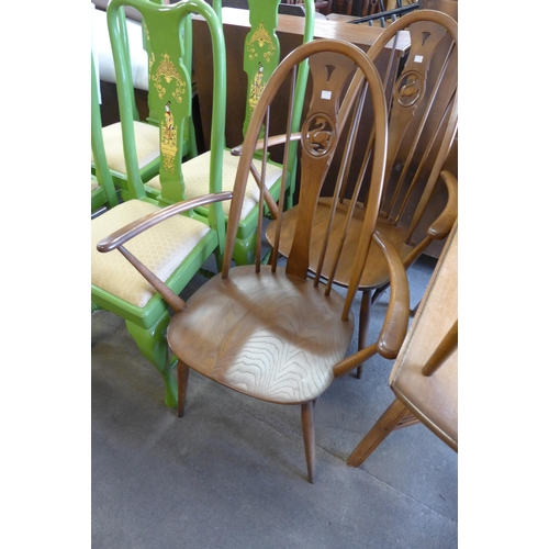 214 - An Ercol Golden Dawn elm and beech Windsor drop leaf table and four chairs