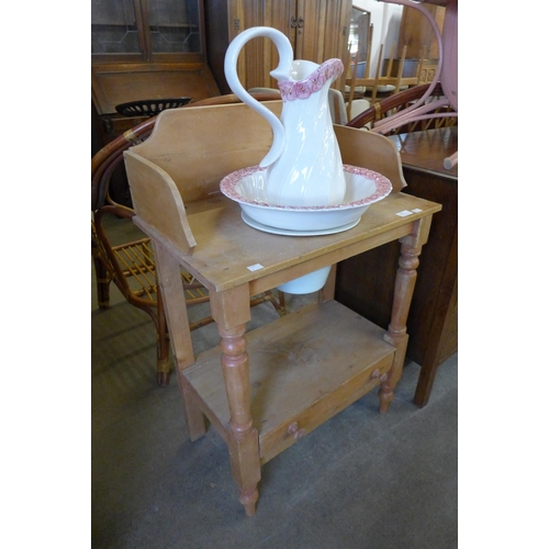 215 - A Victorian style pine washstand, with porcelain jug and bowl