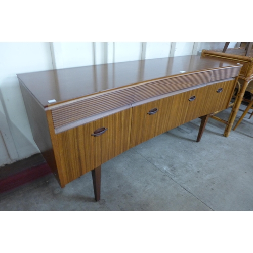 22 - An Elliotts of Newbury afromosia concave sideboard