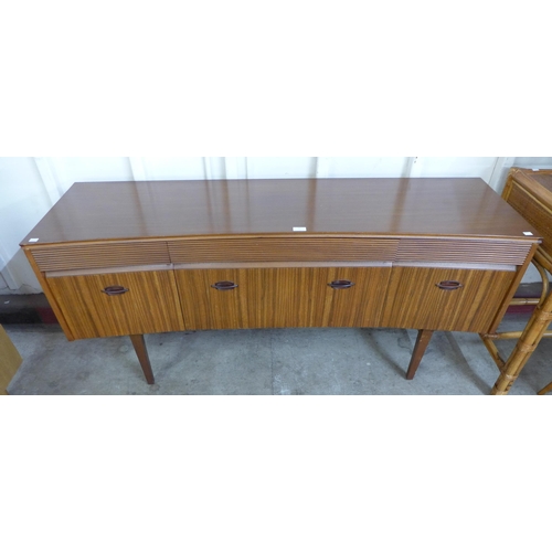 22 - An Elliotts of Newbury afromosia concave sideboard