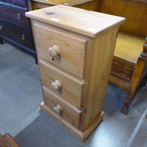 222 - A small pine three drawer chest