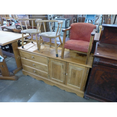 224 - A pine sideboard and three assorted chairs