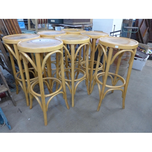 254 - A set of seven beech bentwood bar stools