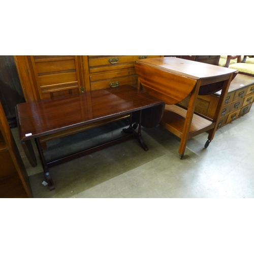 255 - A mahogany drop-leaf trolley and a coffee table