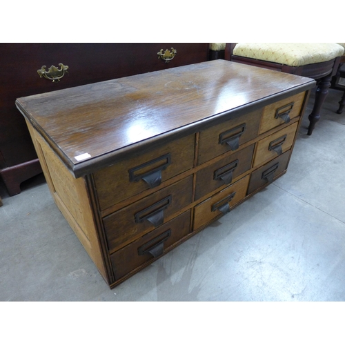 257 - An oak nine drawer table top chest