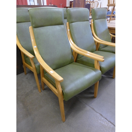 265 - A set of six beech and green vinyl upholstered armchairs