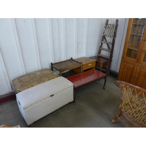 267 - A mahogany coffee table, two ottomans, a simulated teak bedside chest, an oak trolley, etc.