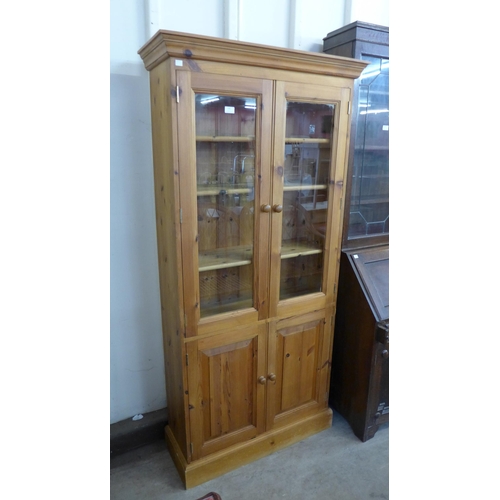 268 - A pine four door bookcase