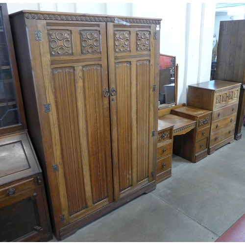 270 - An Old Charm carved oak three piece bedroom suite