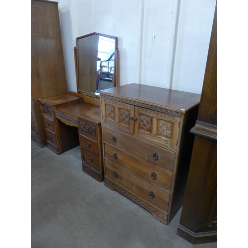 270 - An Old Charm carved oak three piece bedroom suite