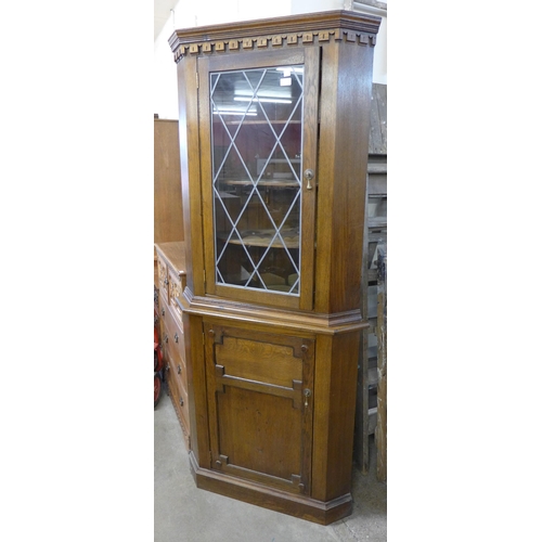 271 - An oak freestanding corner cabinet