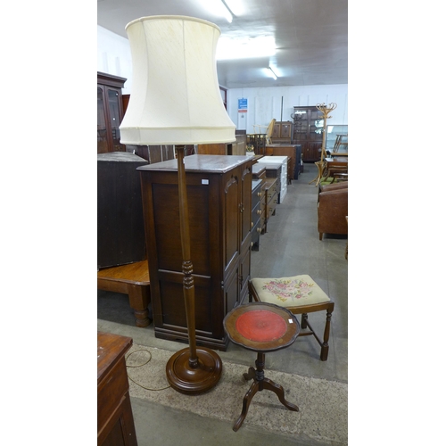 275A - A beech standard lamp, a mahogany tripod wine table and a stool