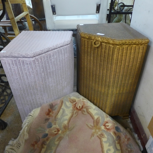 281 - Two wicker linen boxes and a small Chinese rug