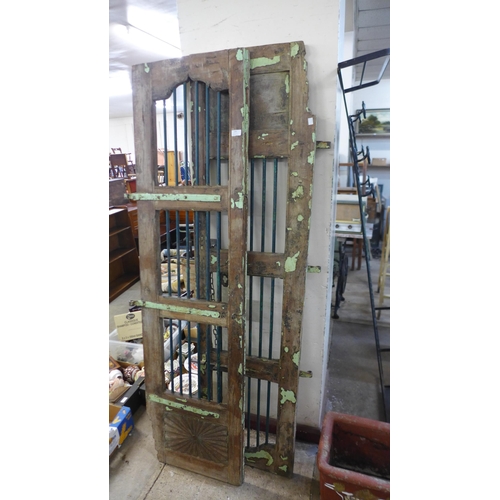 283 - A pair of Indian hardwood shutter doors