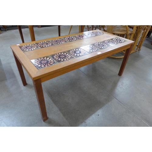 29 - A Danish teak and tiled top rectangular coffee table