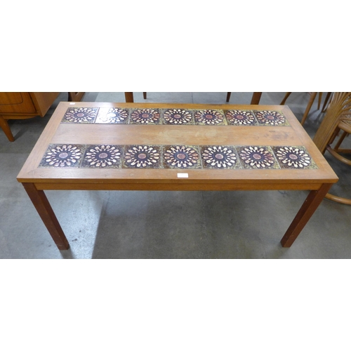 29 - A Danish teak and tiled top rectangular coffee table