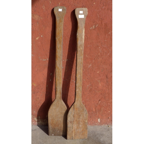 291 - A pair of vintage wooden paddles