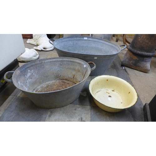 304 - Two tin baths and an enamelled bowl