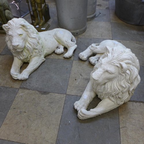 308A - A pair of concrete garden figures of recumbent lions